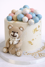 Torta oso con esferas pastel 